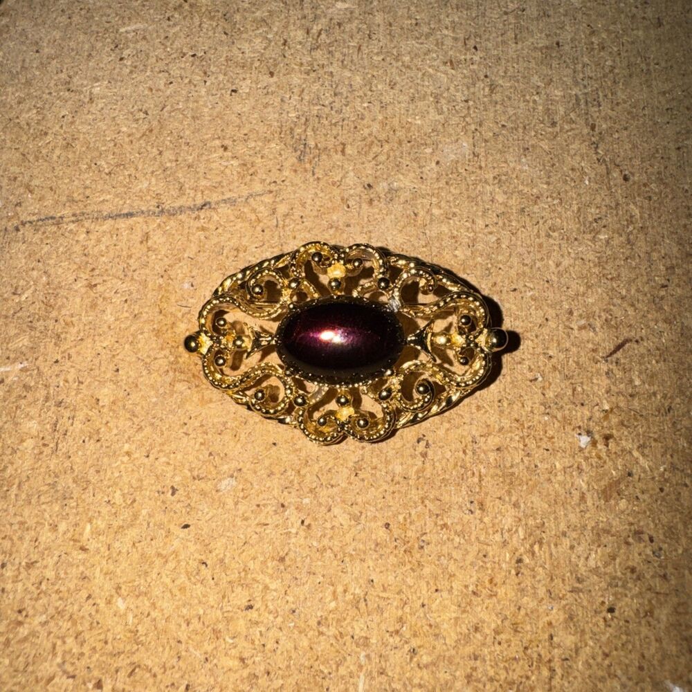Vintage Golden Brooch With Deep Amethyst Glass Cabochon